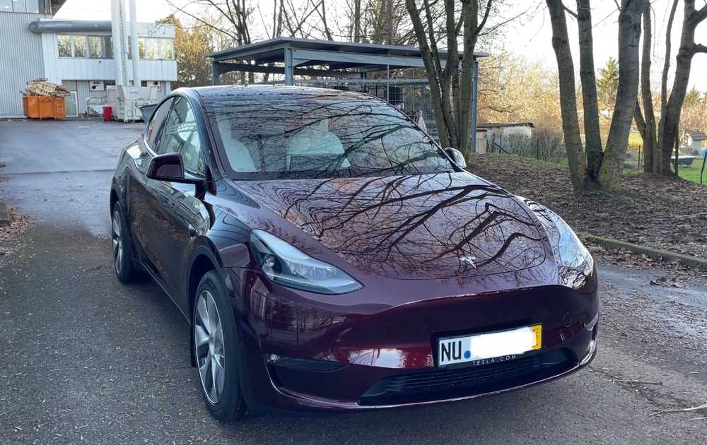 our Tesla Model Y Long Range in midnight cherry red, taken delivery in Germany
