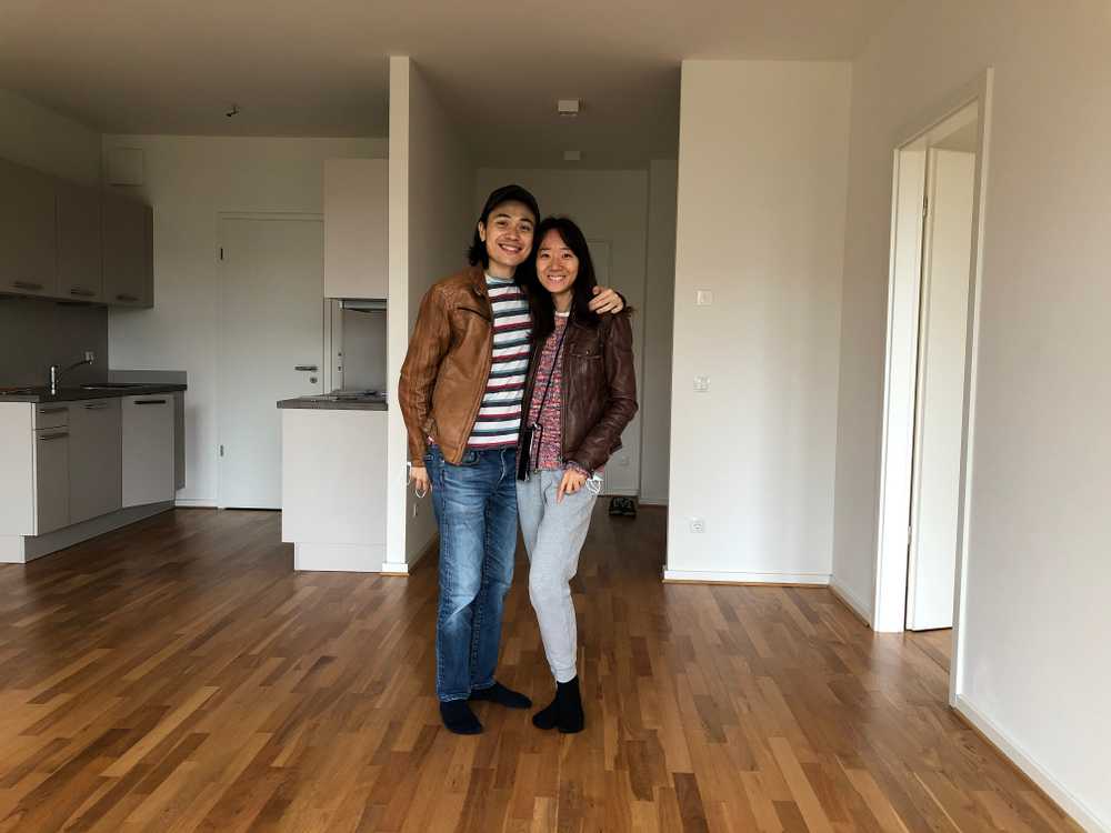 a picture of Nick and Charlane in an empty new rental apartment