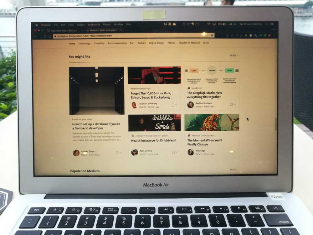 laptop with screen showing medium website with a lot of online advice